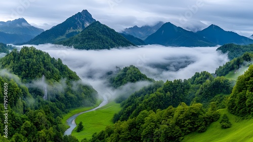 Serene Mountain Landscape with Fog and Lush Green Valleys.