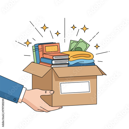 Hand holding a box filled with donations such as clothes books and money for charity.