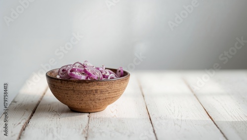 Red onions arranged in a ru...