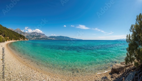 Fototapeta Naklejka Na Ścianę i Meble -  Scenic shoreline view of the Adriatic Sea with mountains in the backdrop, seasonal change