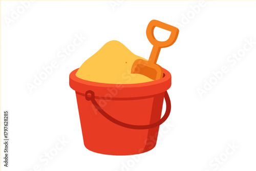 Bright red plastic bucket filled with yellow sand and an orange toy shovel for beach play