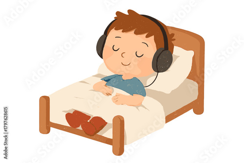 Young child relaxing in bed listening to music through large headphones