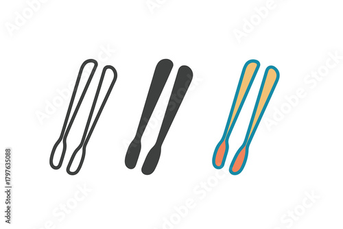Three different colored toothbrushes are shown in a row. The black and white toothbrushes are next to each other, and the orange toothbrush is in the middle