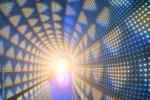 Fototapeta Naklejka Na Ścianę i Meble -  Abstract light tunnel in the recreational park. Many small colorful lighting bulbs decorated.