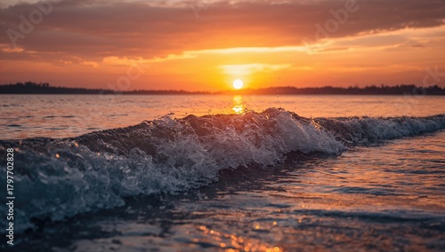 Fototapeta Naklejka Na Ścianę i Meble -  The gentle wave on a serene ocean during sunset, reflecting seasonal change