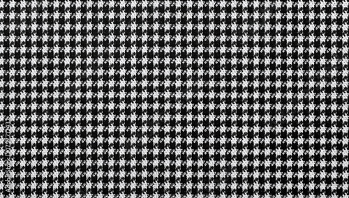 Sample of houndstooth fabric in black and white, ideal for textile design
