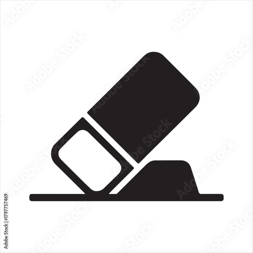 Simple black icon of an eraser removing a mark from a surface symbolizing correction and deletion
