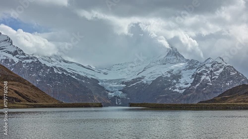 Time lapse, view on a lake surrounded by mountains. Bachalpsee or Lake Bachalp, Grindelwald, canton of Berne, Switzerland