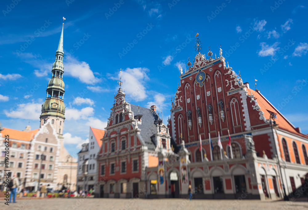 Fototapeta premium Riga Old Town view, Latvia, streets of Vecriga historical center with Town Hall square, House Of The Black Heads, Cathedral and church, travel to Latvia and Baltic States, summer day with a blue sky