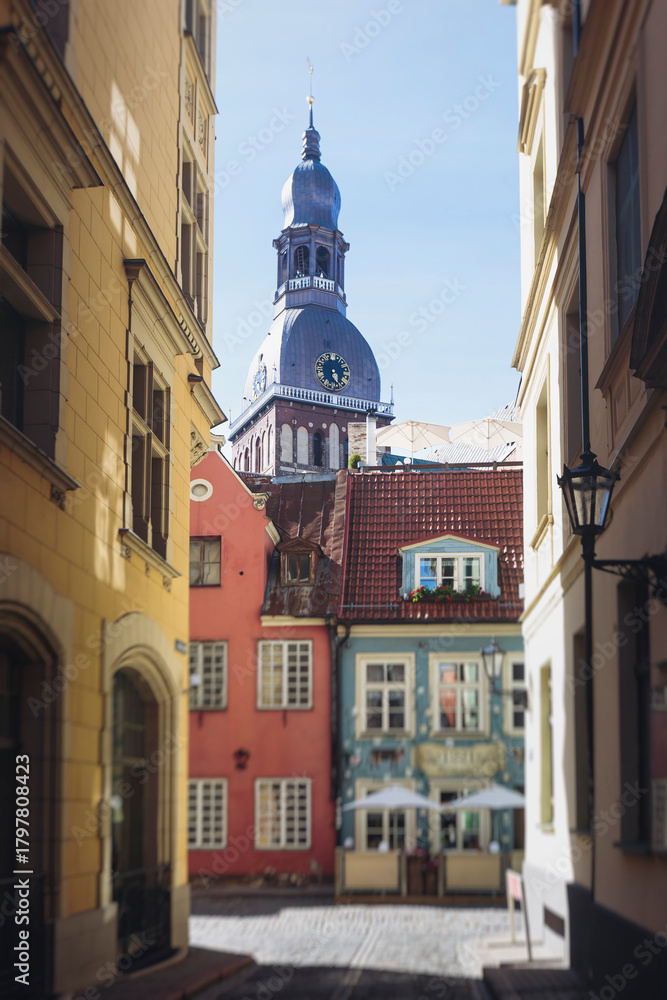Fototapeta premium Riga Old Town view, Latvia, streets of Vecriga historical center with Town Hall square, House Of The Black Heads, Cathedral and church, travel to Latvia and Baltic States, summer day with a blue sky