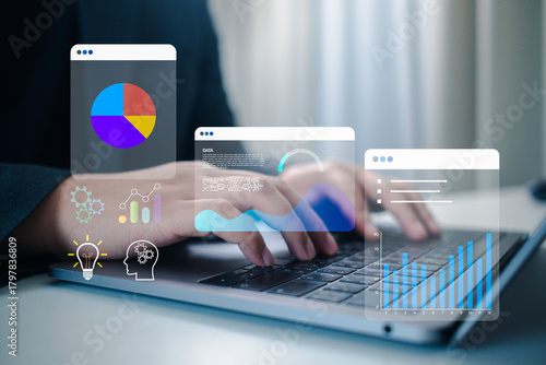 Professional hands typing on a laptop with holographic data charts and icons. This image represents innovation, strategic planning, business intelligence, and digital idea generation.