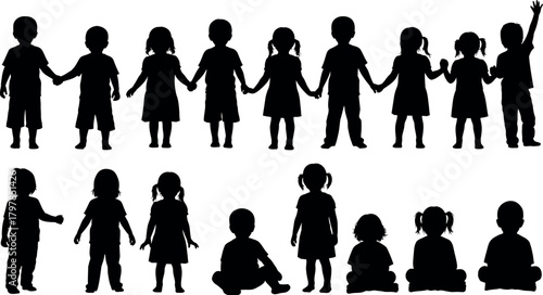 Diverse group of children holding hands in a line and sitting together in silhouette