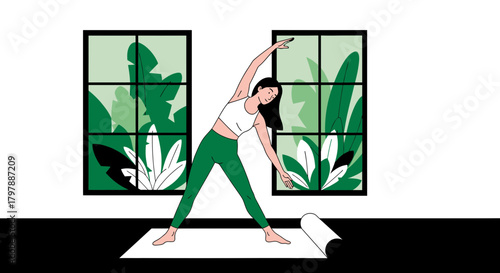 Woman practicing triangle pose yoga in a bright room with lush green views from the windows
