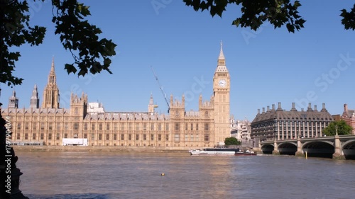 View of London, Houses of Parliament building with Big Ben. British history, Palace of Westminster, river bank. High quality 4k footage
