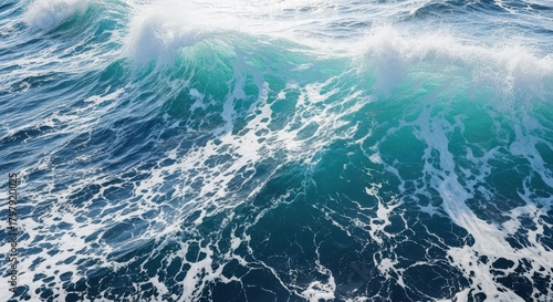 Fototapeta Naklejka Na Ścianę i Meble -  Closeup view of a powerful ocean wave crashing with white foam and turquoise water, capturing the dynamic energy of the sea under bright sunlight