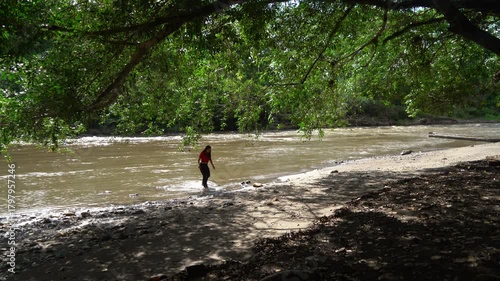 Woman walking alone near the river 
