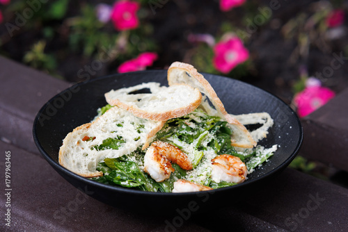 A Picnic Dish in the Garden with Yogurt, Roasted Chicken. brightly blooming Flowers