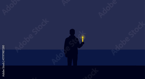 Silhouette of a person holding a candle casting light in the night landscape scene