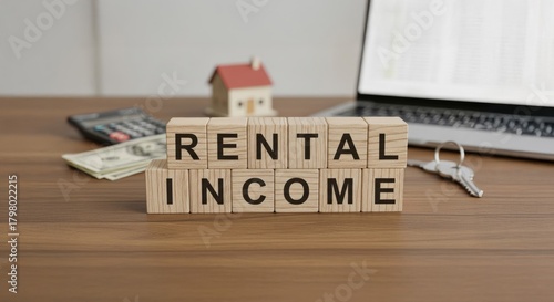 Rental Income: This image captures the essence of property investment with wooden blocks spelling out RENTAL INCOME, complemented by a miniature house, laptop, calculator, money, and a key.