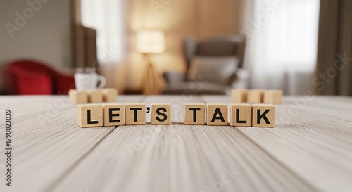 Let's Talk Arrangement: Wooden letter blocks spell out Let's Talk, arranged on a wooden surface, with soft natural light enhancing a sense of calm, inviting dialogue and open communication.