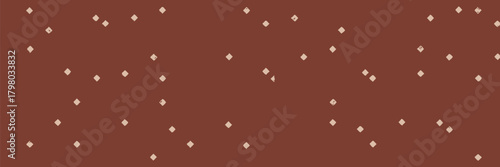 A repeating pattern of small light pink diamond shapes scattered across a solid brown background surface view