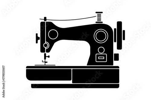 Silhouette of a vintage sewing machine on a white background