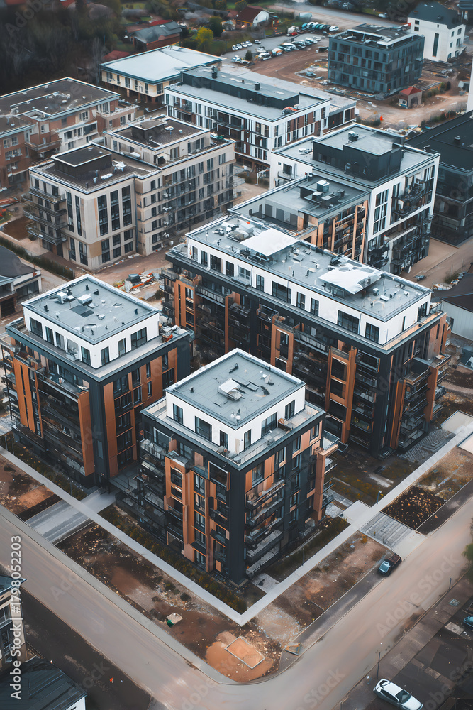 Obraz premium Vertical Photo of New Residential Development with Apartment Buildings