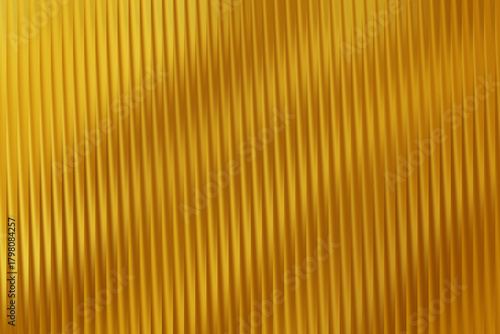 Abstract metallic golden texture with vertical lines creating a shimmering and reflective surface effect seen closely