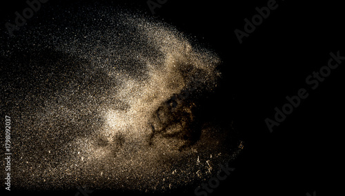 Dark sand dust explosion isolated on black background
