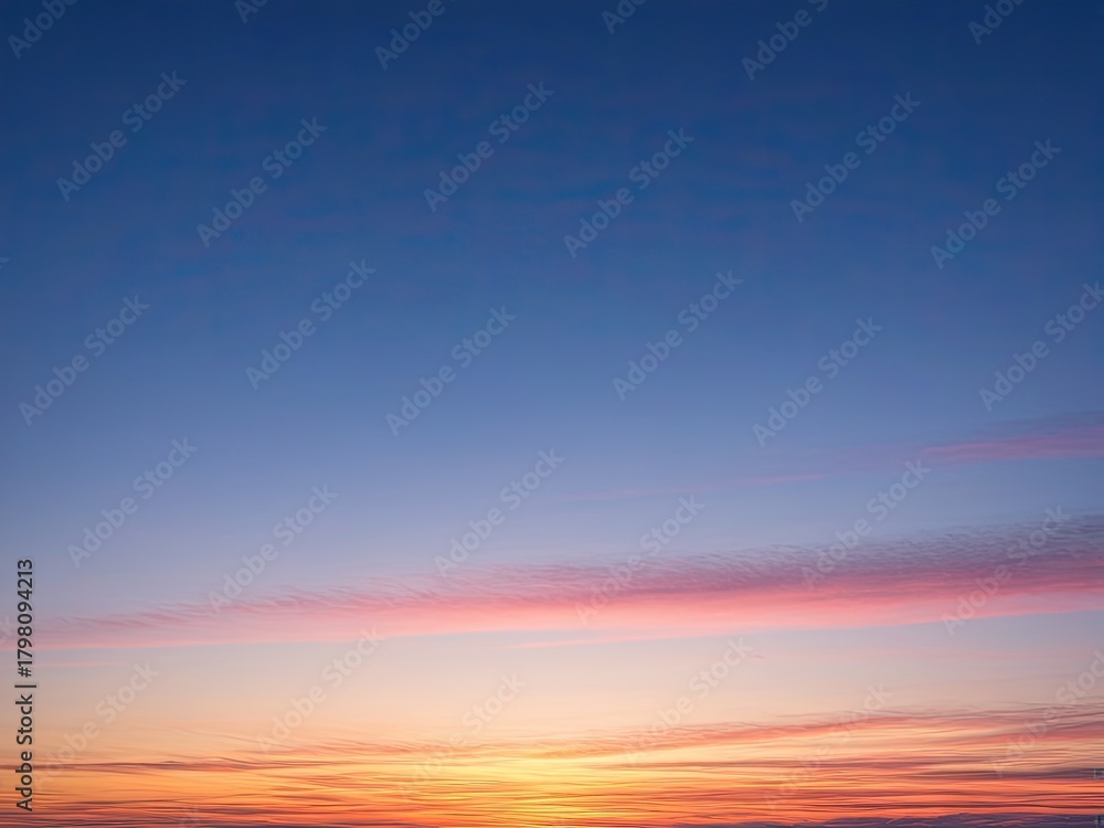 Fototapeta premium Serene Sunset Sky: Vibrant Orange and Pink Clouds at Dusk - Peaceful Atmospheric Background for Design