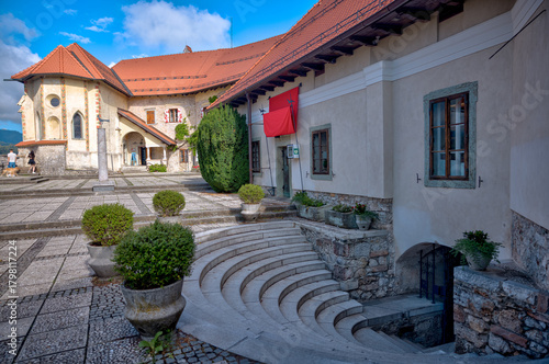Lake Bled, Slovenia – July 22, 2025: Cobblestone courtyard and traditional buildings within the historic Bled Castle overlooking the lake.
