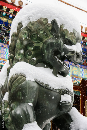 Snowy Lion Statue in Traditional Chinese Setting