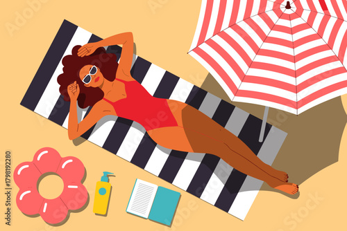 Chic Woman Relaxing in a Vibrant Red Swimsuit Under a Striped Umbrella on a Sunny Beach Day