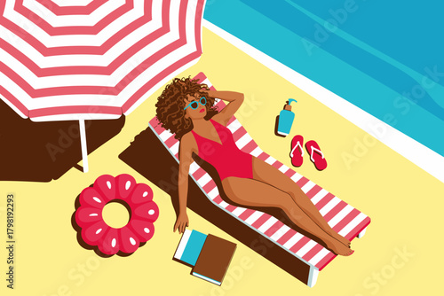 Sun-Kissed Woman Relaxing Under a Striped Umbrella on Vibrant Beach with Inflatable Flower
