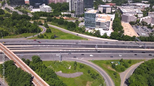Skyscrapers and freeways in a busy urban landscape. Transportation highways combine with business architecture in a dynamic landscape.
