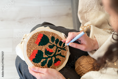 Creative embroidery session in a cozy indoor space with floral design being crafted on fabric