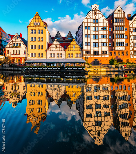 Old houses and street in Gdansk on the Motlawa river