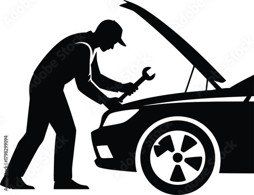 Black silhouette of a mechanic working on a car engine