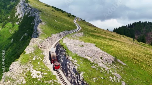 Drone Austria 4k. Schafberg Bahn, historic cog railway in Austria, it runs from St. Wolfgang up Schafberg mountain. popular summer travel tourism destination for hiking in Europe.