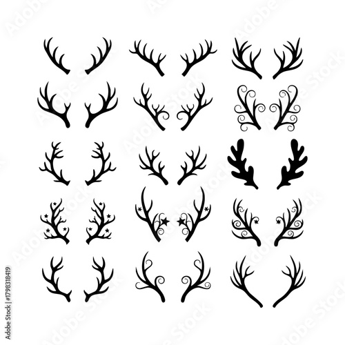 Collection of black deer antlers and decorative branches, isolated on
