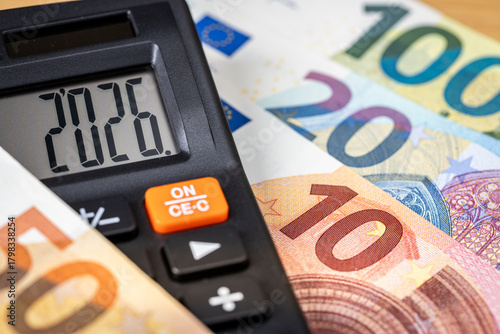 Fototapeta Naklejka Na Ścianę i Meble -  Eurozone 2026 year. Financial business concept. Money and calculator with date 2026. Market analysis. Euro currency.  exchange rate. Economic background. closeup