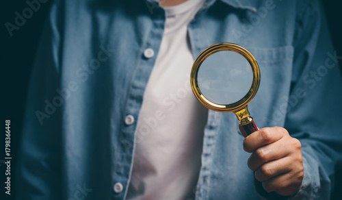 Hand holding magnifying glass, verification awareness, careful inspection mindset, analytical thinking support, detail investigation insight, accuracy responsibility and review concept