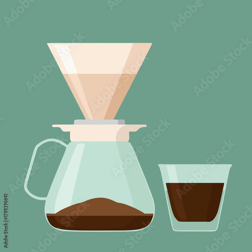 Pour-over coffee brewing in glass carafe with filter and a glass of coffee.