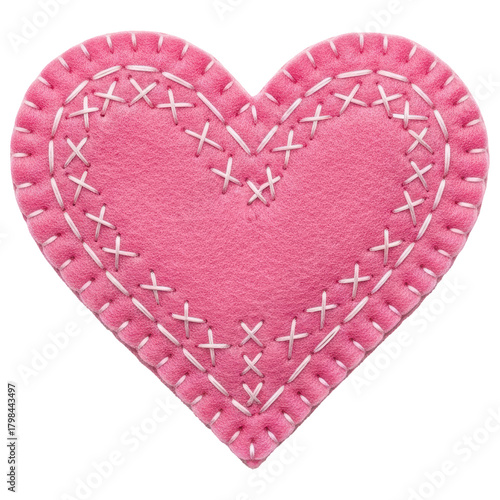 Handmade pink felt heart with decorative white cross stitching for love and craft projects