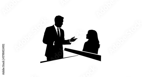 Business professionals in silhouette engaged in conversation at a desk