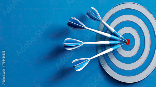 Blue darts hitting center of target