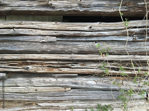 Horizontal, hand hewn logs on an ancient barn in the Appalachian mountains of Madison County, NC