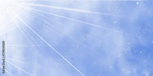 Bright rays of light in blue sky. Winter sun in the blue sky. Blue sky with picturesque fluffy clouds background. Blue sky with fluffy white clouds. Beautiful nature background.