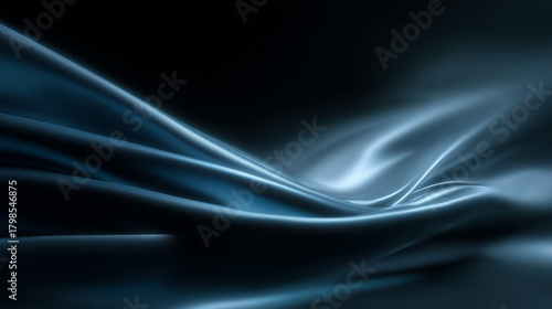 Elegant blue satin fabric waves in soft folds with smooth lighting and luxurious texture on a dark background.