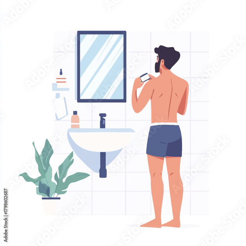 Man Shaving in Bathroom Focused on Grooming Routine.